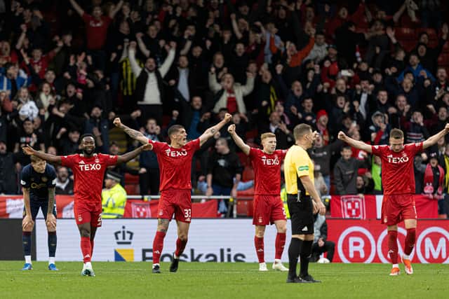 The Aberdeen players celebrate another win, this time over Hearts.