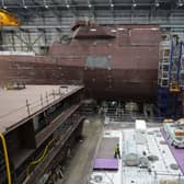 Construction work has begun on the third of five Type 31 ships HMS Formidable. Pictured is work continuing on HMS Venturer(top) and HMS Active in the Venturer building ahead of the Steel Cut ceremony for the Royal Navy's third in class Type 31 frigate, HMS Formidable, at Babcock International Group, in Rosyth.