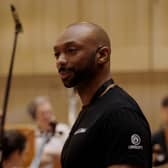 Star Wars Outlaws composer Wilbert Roget while recording the game's score with the Royal Scottish National Orchestra.