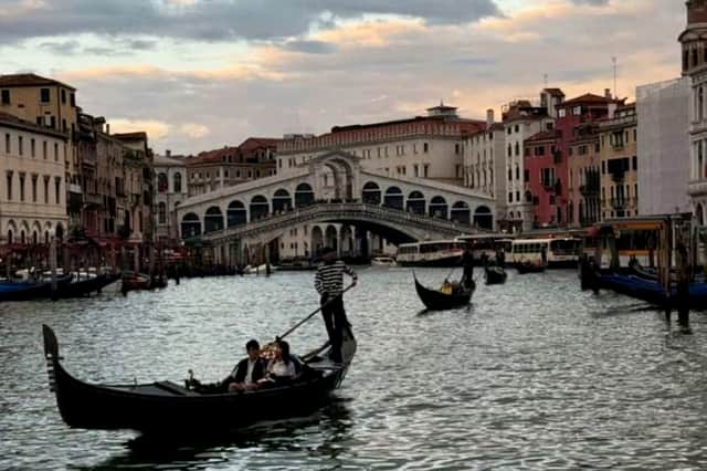 The couple travelled a collective 2,300 miles for their first date in Venice, Italy after talking online for a month. Picture: Nafis Delowar/SWNS