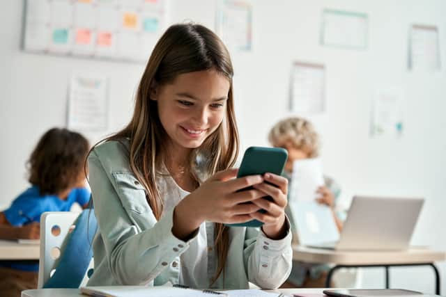 School kid on phone