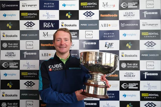 Calum Fyfe shows off the Tartan Pro Tour’s Tour Championship trophy after his impressive win at Trump International Golf Links in Aberdeen