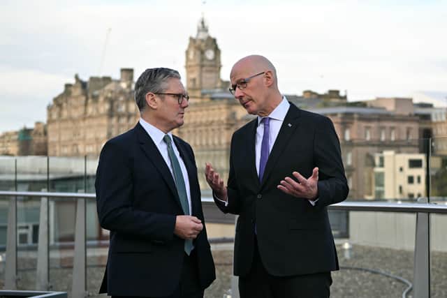 Prime Minister Sir Keir Starmer speaks with First Minister John Swinney during the Council of the Nations and Regions in Edinburgh. Picture: Andy Buchanan/PA Wire