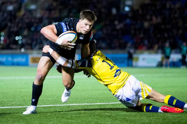 Huw Jones breaks through to score his first try of the night.