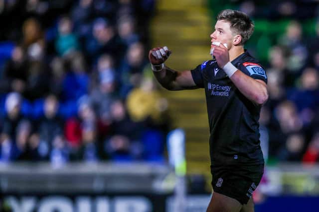 Huw Jones celebrates his second try against Zebre.