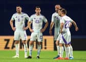The Scotland players are left dejected after their seemingly late equaliser was chalked off for a marginal offside call.