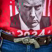 A supporter of Republican US presidential candidate Donald Trump shows his allegiance outside a campaign rally in West Palm Beach, Florida, earlier this year (Picture: Giorgio Viera)