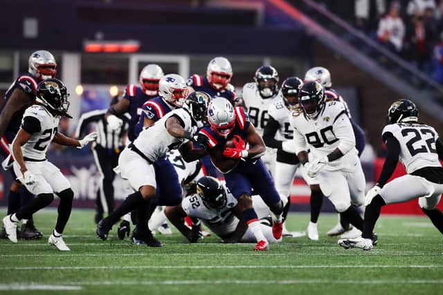 Rhamondre Stevenson #38 of the New England Patriots runs with the ball in the third quarter of the game against the Jacksonville Jaguars at Gillette Stadium on January 02, 2022 in Foxborough, Massachusetts.