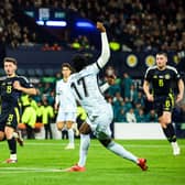 Scotland debutant Nicky Devlin makes a vital block to deny Portugal's Rafael Leao. (Photo by Ross MacDonald / SNS Group)