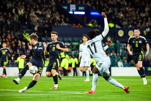 Scotland debutant Nicky Devlin makes a vital block to deny Portugal's Rafael Leao. (Photo by Ross MacDonald / SNS Group)