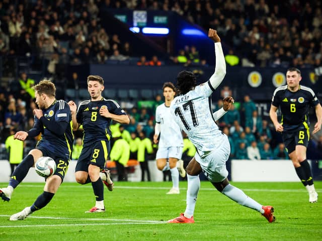 Scotland debutant Nicky Devlin makes a vital block to deny Portugal's Rafael Leao. (Photo by Ross MacDonald / SNS Group)