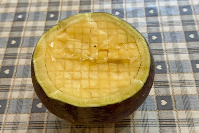 Loosen the flesh by cutting a grid into the top of the turnip.