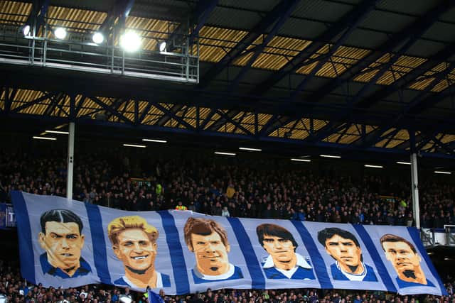 The supporters of Everton FC display a banner showing former players Dixie Dean, Dave Hickson, Joe Royle, Bob Latchford, Graeme Sharp and Duncan Ferguson in 2019.