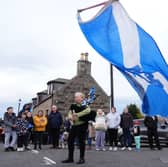 A piper plays outside after the coffin of former first minister of Scotland Alex Salmond arrives at a funeral parlour in Fraserburgh. PIC: PA.
