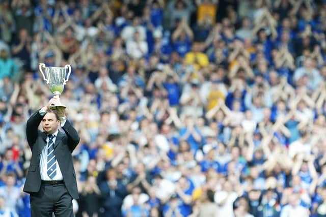 Sharp holds aloft the 1985 Cup Winners Cup back in 2004.