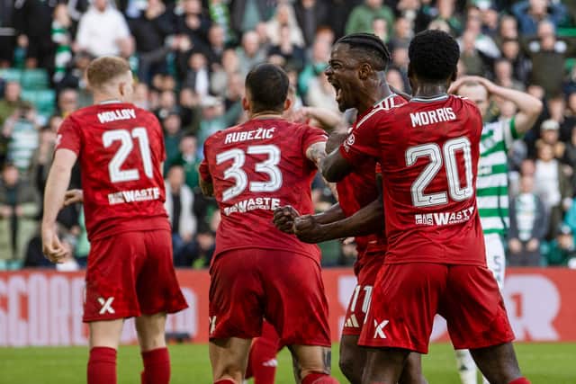 Aberdeen celebrate their draw at Parkhead.