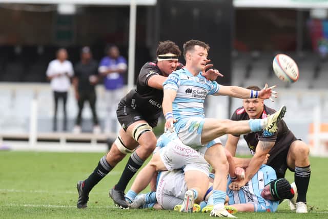 George Horne tries to clear against the Sharks.