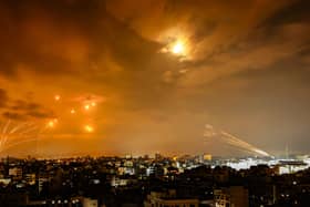 Rockets fired by Palestinian militants from Gaza City are intercepted by the Israeli Iron Dome defence missile system