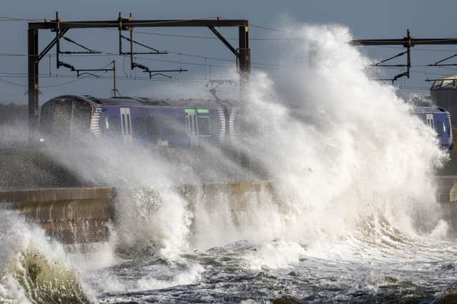 A ScotRail train battered by waves from the Clyde in Saltcoats during Storm Ashley in October