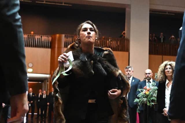 Australian Senator Lidia Thorpe disrupts proceedings during King Charles' visit.
