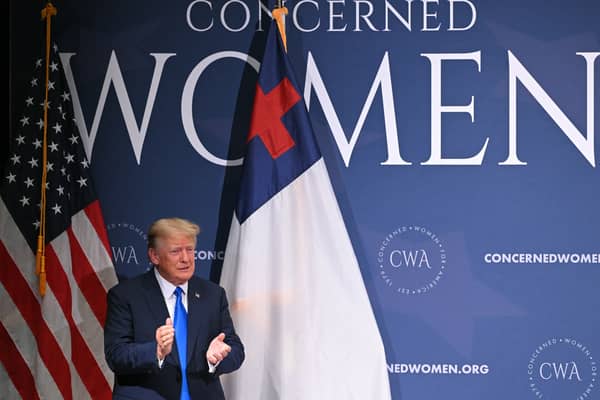 Donald Trump applauds the audience at a summit held by the Concerned Women for America group last year (Picture: Mandel Ngan)