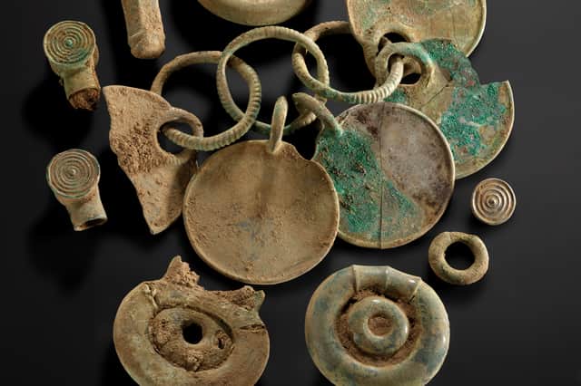 A selection of Bronze Age objects from the Peebles Hoard, including the rattle pendant. Picture: National Museums Scotland