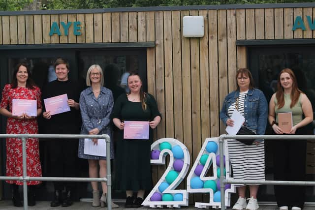 The Young Enterprise Scotland chief executive with people who have completed YE Scotland programmes