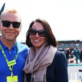 Sir Chris Hoy and Sarra Hoy pose for a photo on the grid during the F1 Grand Prix of Great Britain at Silverstone Circuit in July. Picture: Mark Thompson/Getty Images