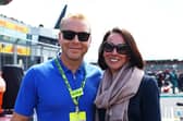Sir Chris Hoy and Sarra Hoy pose for a photo on the grid during the F1 Grand Prix of Great Britain at Silverstone Circuit in July. Picture: Mark Thompson/Getty Images