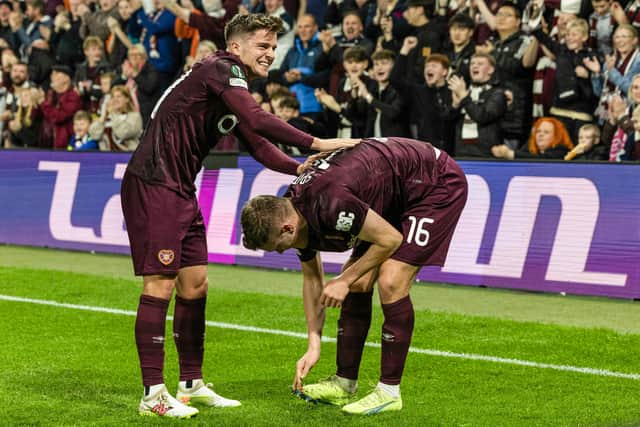 Cammy Devlin congratulates Spittal on his goal.