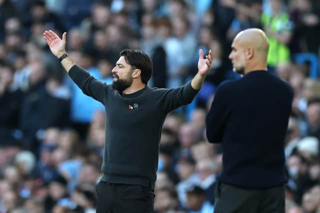 Pep Guardiola and Russell Martin on the sidelines during Man City v Southampton.