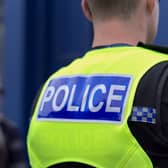 The pedestrian was struck by a small black car, with Police Scotland officers hunting for the driver