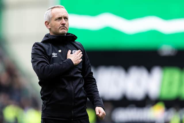 Neil Critchley salutes the Hearts fans at full time.