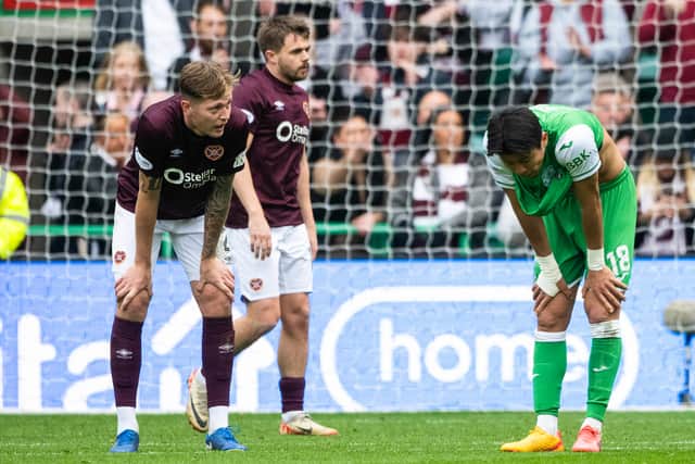 Hearts' Frankie Kent and Hibs' Hyeokkyu Kwon at full time.