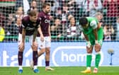 Hearts' Frankie Kent and Hibs' Hyeokkyu Kwon at full time.