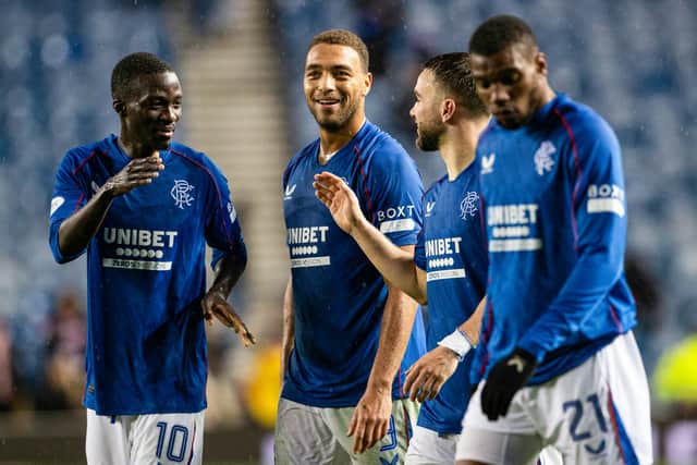 Rangers' Mohamed Diomande, Cyriel Dessers and Nicolas Raskin celebrate at full time.