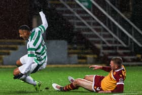 Motherwell defender Liam Gordon tackles Celtic striker Adam Idah which resulted in a red card after a VAR check. (Photo by Craig Williamson / SNS Group)