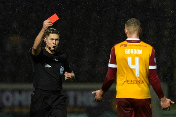 Motherwell's Liam Gordon is shown a red card for his challenge on Celtic's Adam Idah after a VAR check. (Photo by Craig Foy / SNS Group)