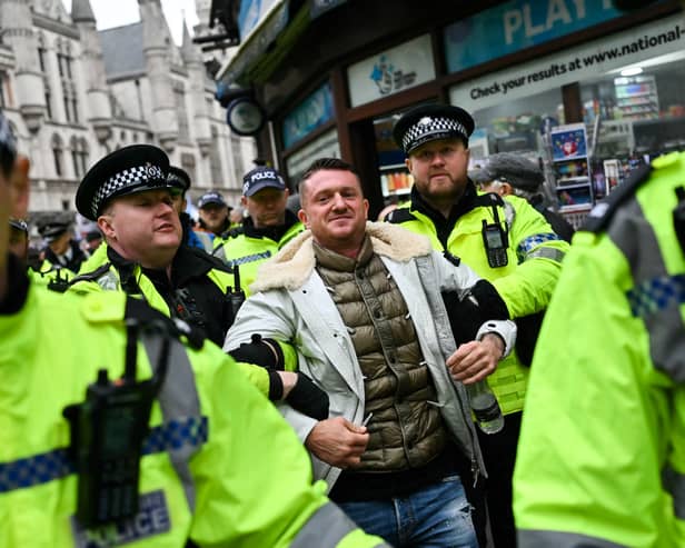 Police arrest far-right activist Tommy Robinson during a demonstration in central London last year (Picture: Justin Tallis)