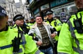 Police arrest far-right activist Tommy Robinson during a demonstration in central London last year (Picture: Justin Tallis)