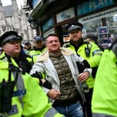 Police arrest far-right activist Tommy Robinson during a demonstration in central London last year (Picture: Justin Tallis)