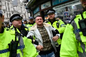 Police arrest far-right activist Tommy Robinson during a demonstration in central London last year (Picture: Justin Tallis)