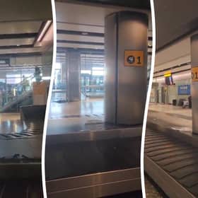 “Sewage” water pours onto baggage carousel at airport.