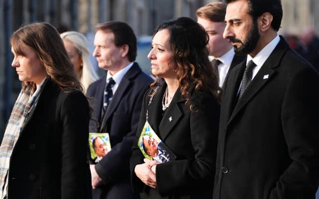 Tasmina Ahmed-Sheikh, centre, with her partner Zulfiqar Sheikh leaving after the funeral service