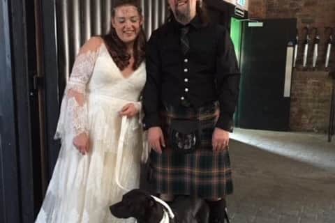 Jade Fellburn, 34 with her husband Stuart, 44, and their dog Merry. Picture: Jade Fellburn/SWNS