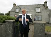 Donald Trump pictured at the house in Tong, on the Isle of Lewis, where his mother was brought up before she emigrated to the United States. 