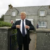 Tycoon Donald Trump pictured at the house in Tong, on the Isle of Lewis, where his mother was brought up before she emigrated to the United States. 