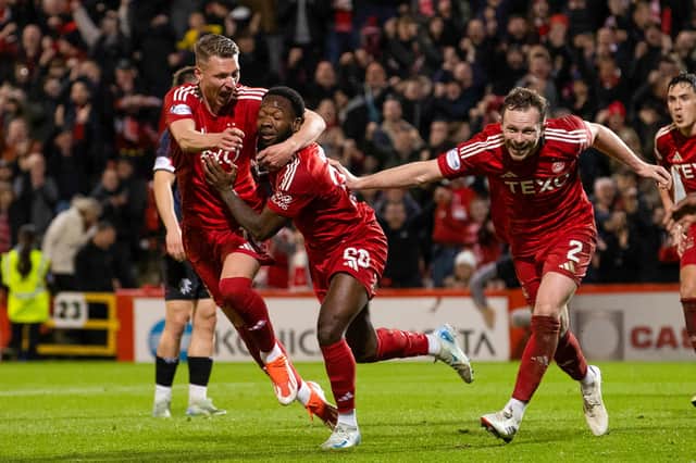 Aberdeen's Shayden Morris celebrates with Ante Palaversa and Nicky Devlin as he scores to make it 2-1 over Rangers at Pittodrie. (Photo by Alan Harvey / SNS Group)