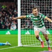 Celtic's Alistair Johnston celebrates scoring to make it 1-0 over Dundee. (Photo by Ross MacDonald / SNS Group)