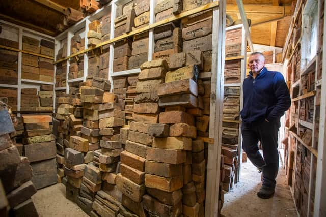 Mark Cranston from Jedburgh, with his collection of over 4,000 bricks. Picture: Katielee Arrowsmith/SWNS